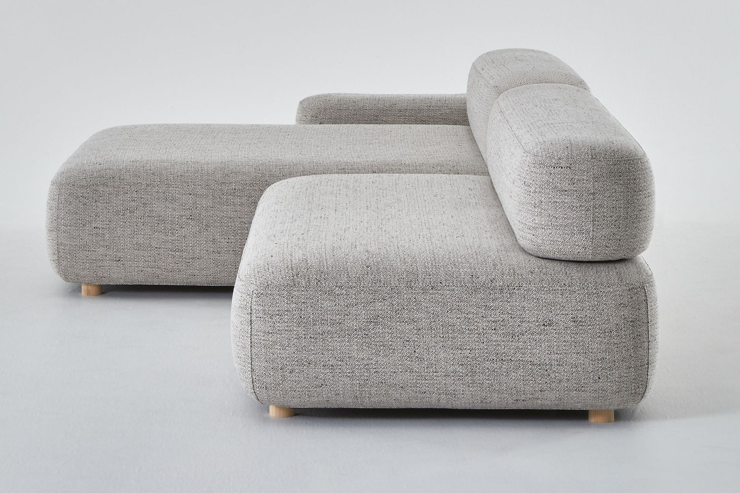 Flux chaise with arm and seat viewed from seat end.
