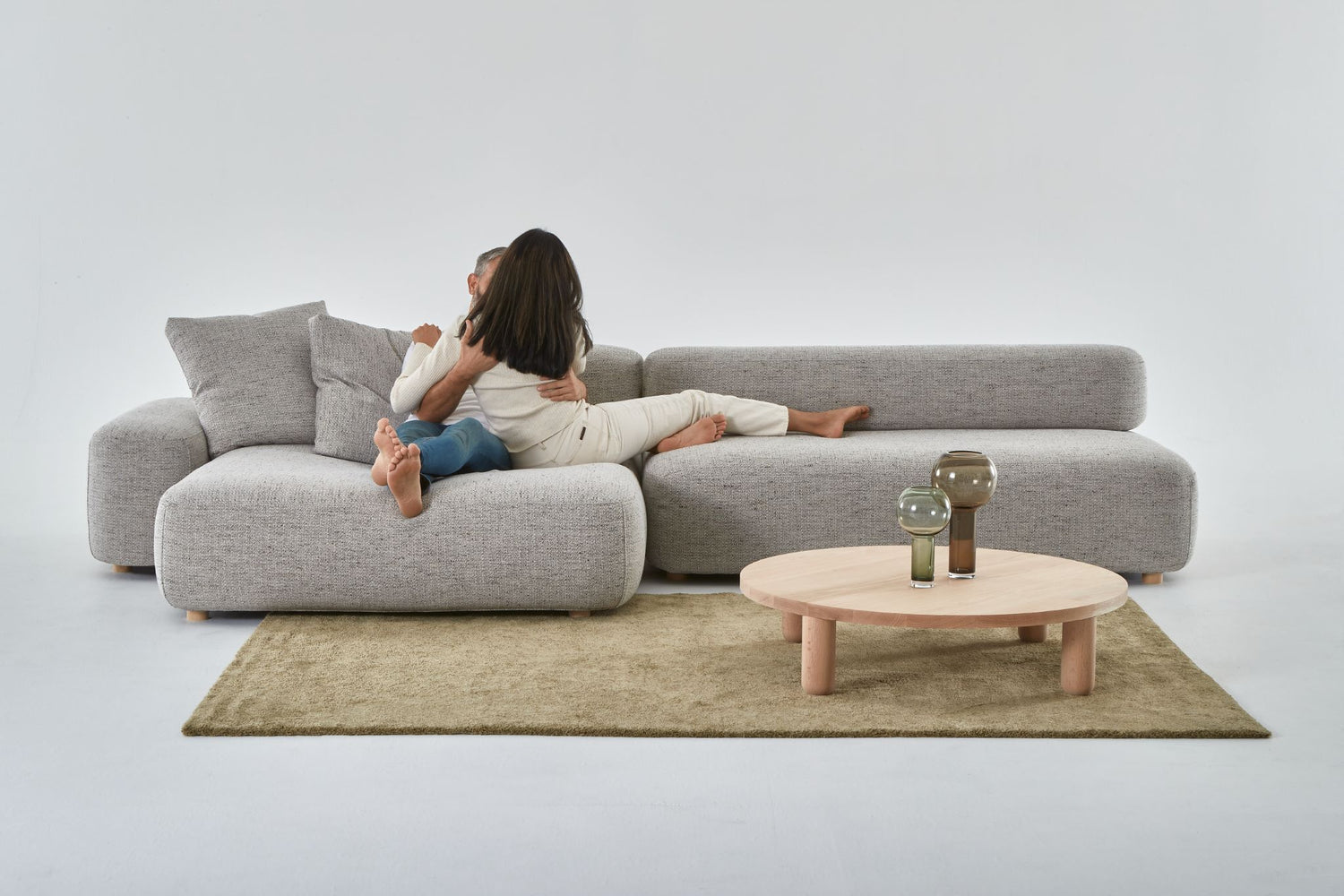 Flux super comfortable modular sofa with couple kissing.