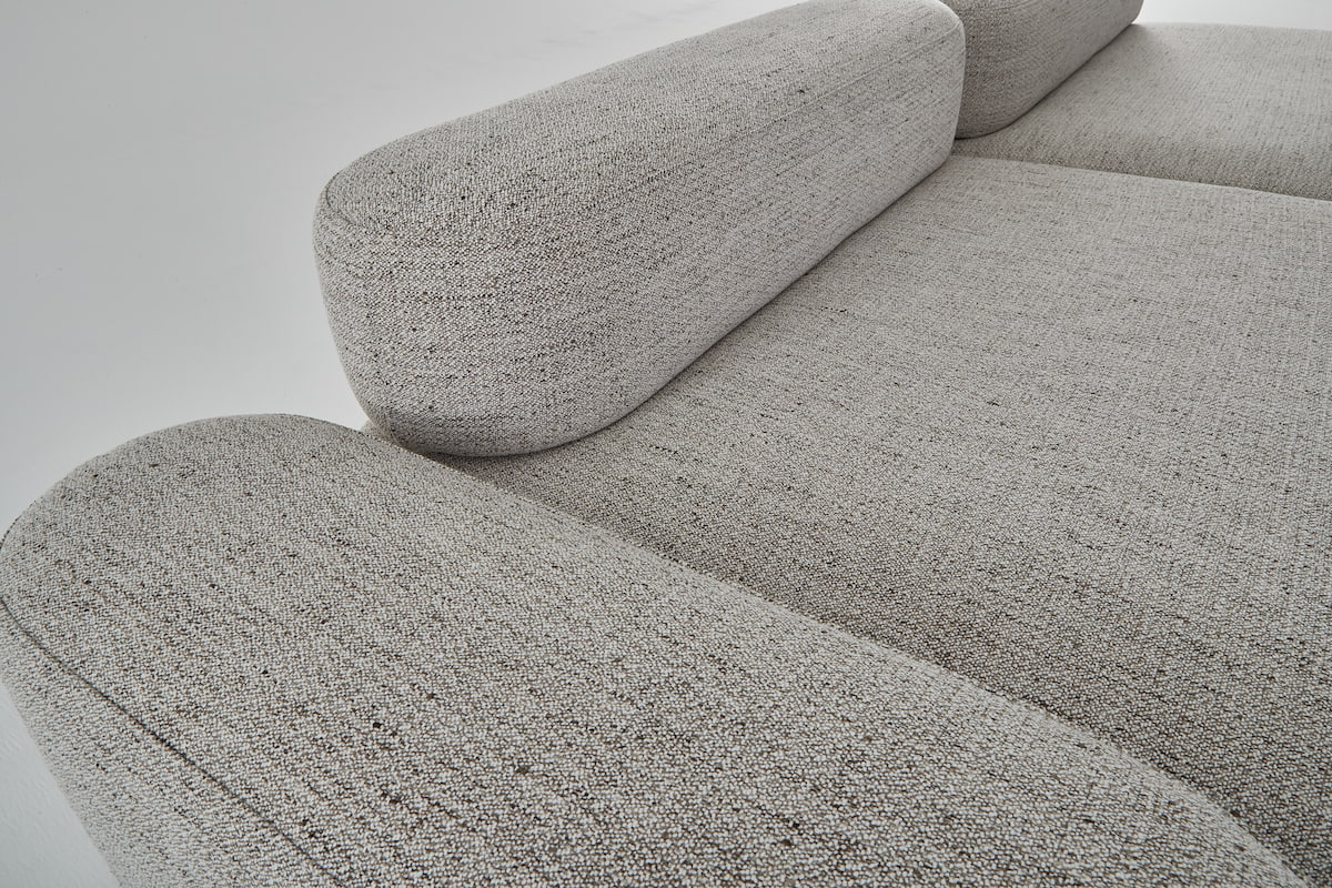 The flux modular sofa in earthy tones showing the arm module and fixed back sofa module.