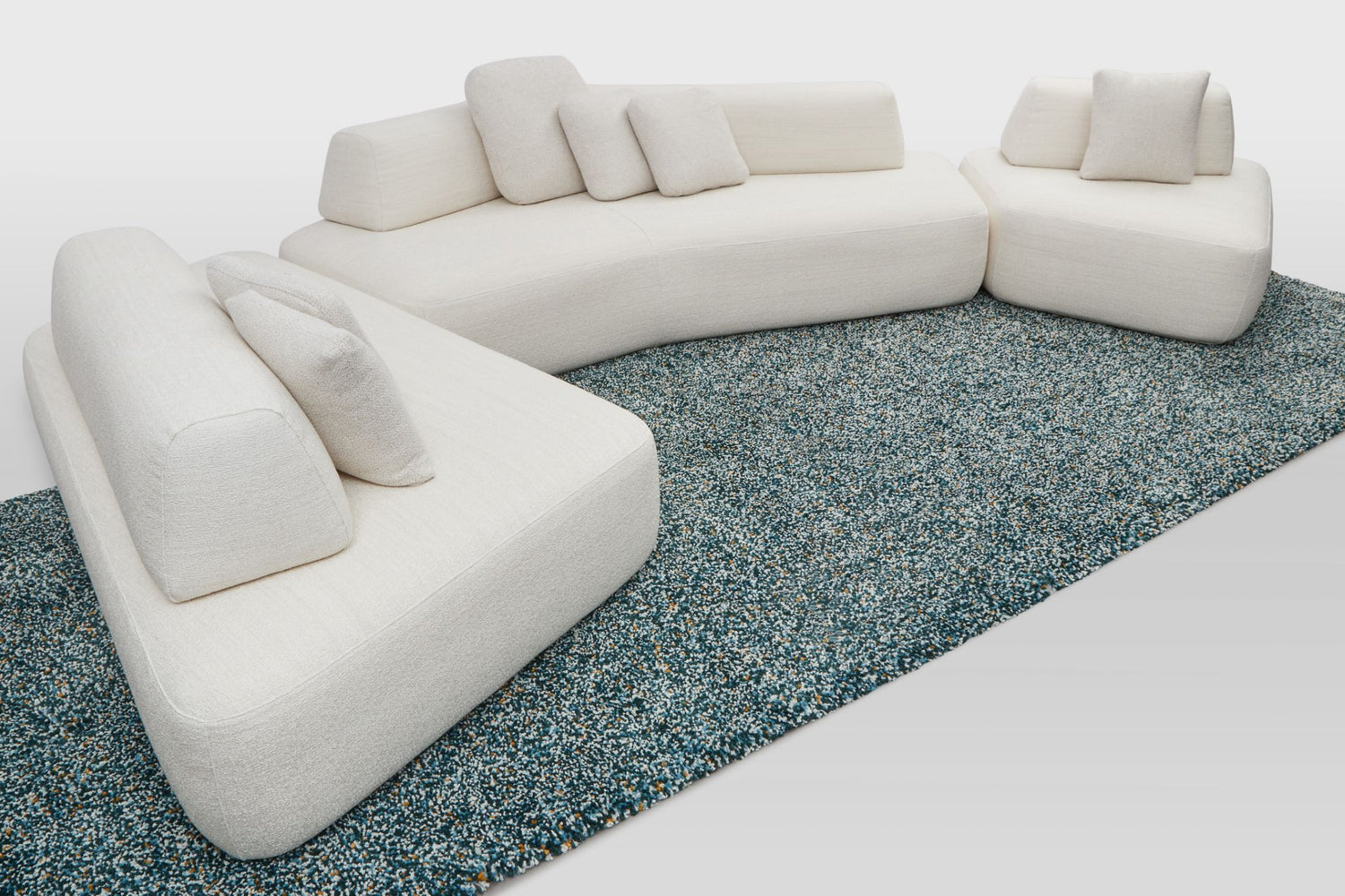 Hectare modular designer lounge in L-shape 6 to 8 seater, wing, boomerang and chair modules in white.