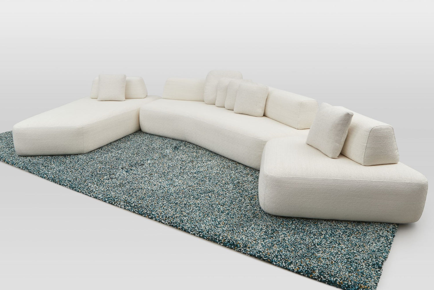 Hectare modular sofa showing the left wing as ottoman, boomerang and chair in white