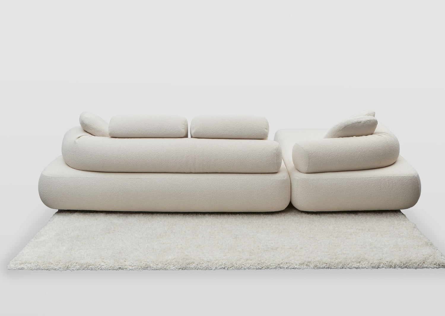 Back view of the Newman designer sofa and chaise with moveable back rolls