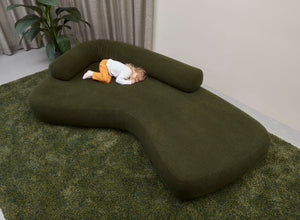 3 metre Rolly sofa in green with moveable back roll and little girl sleeping
