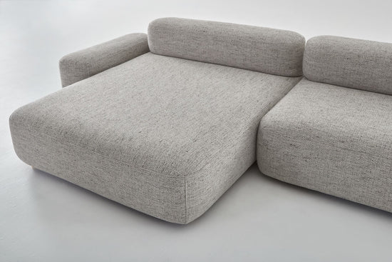 Flux comfortable modular sofa showing chaise with arm rest and seating module.