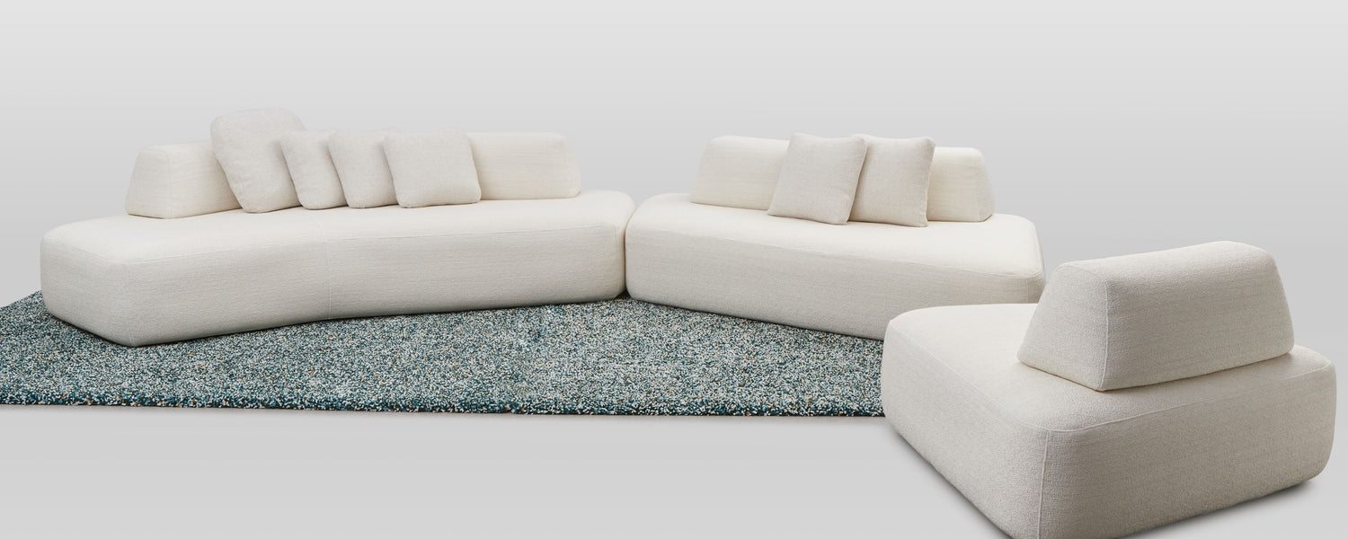 Hectare modular sofa showing three modules, boomerang, wing and the ottoman used as a chair.