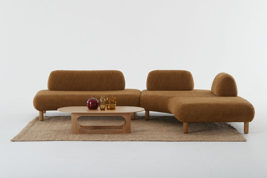 Setting of Locus modular sofa showing a left end and a right chaise in burnt orange