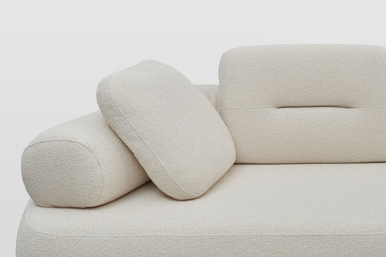 Newman designer sofa showing the back roll arm rest, with back rest cushion and scatter cushion in white boucle