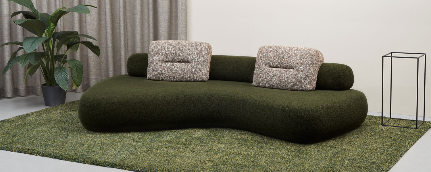 Rolly 3 metre designer sofa with moveable back roll and back cushions in green.