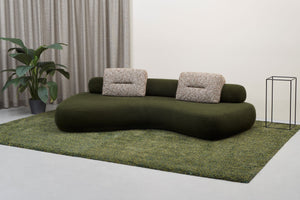 Rolly designer sofa with moveable back roll and optional cushions in green. Fabric Nepal, Vert-Sapin